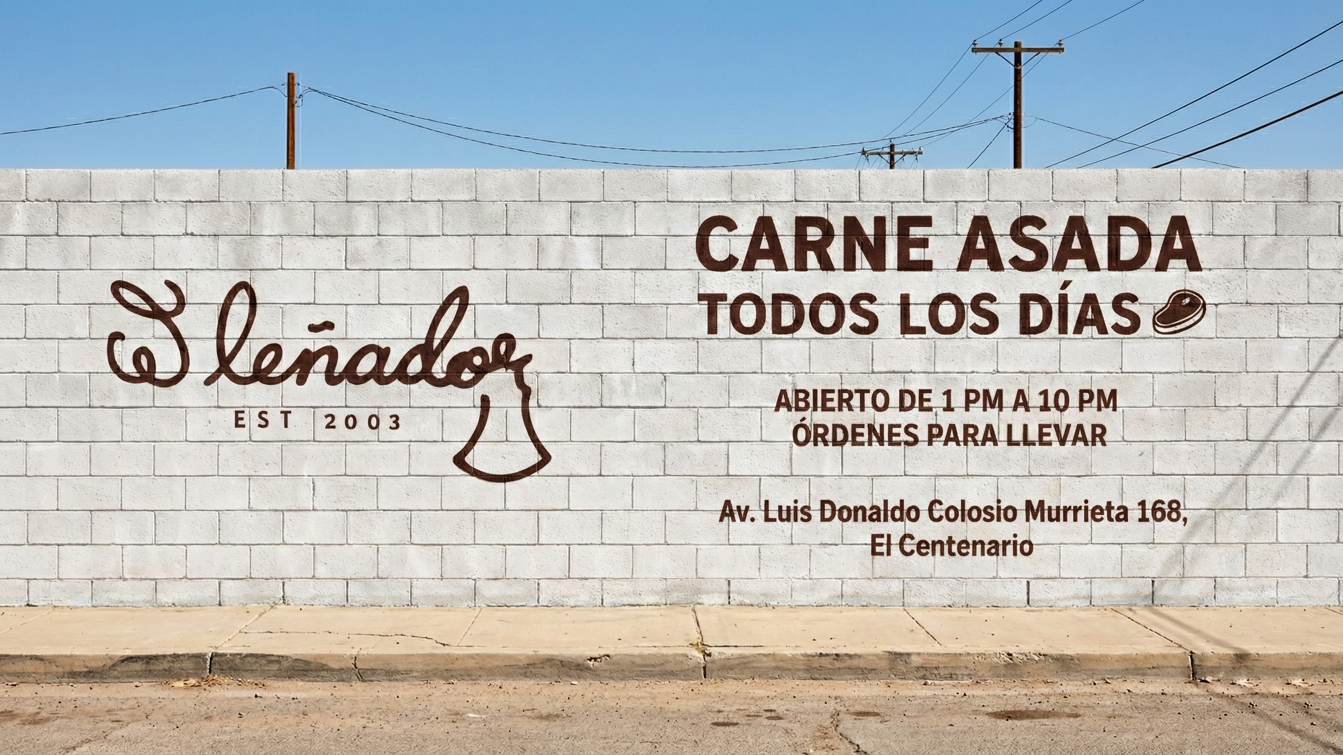A white brick wall with a hand-painted sign and a street scene. The sign, on the left, displays the text 'El Leñador' in cursive script, the one on the right the copy.