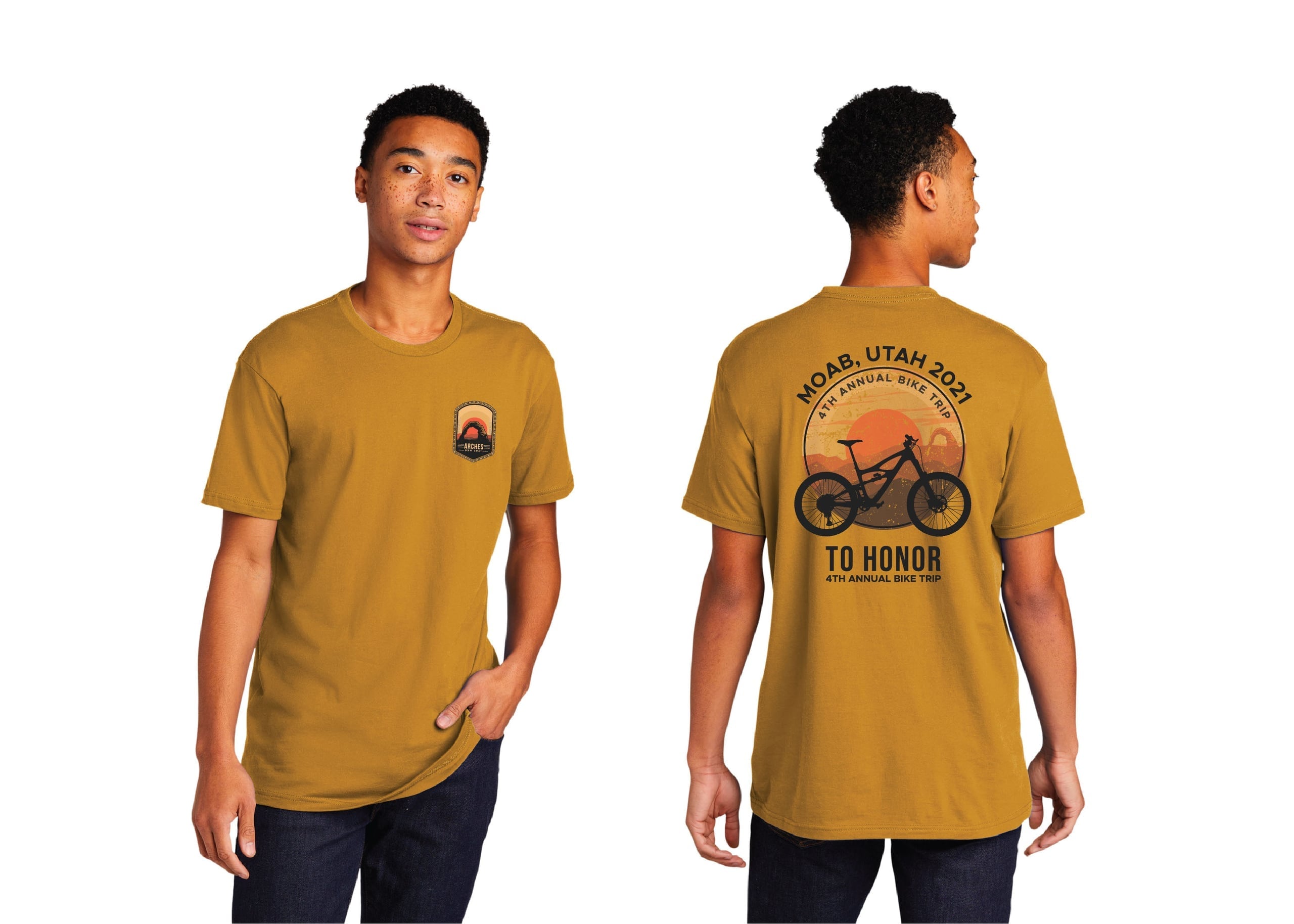 A man wearing a beige t-shirt with a graphic print featuring a bicycle and text, stands against a white background. The design showcases the shirt's layout, typography, branding, and context. The graphic elements include a yellow bicycle and a black ribbon on the shirt's front.